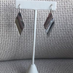 Silver colored diamond shaped hanging earrings